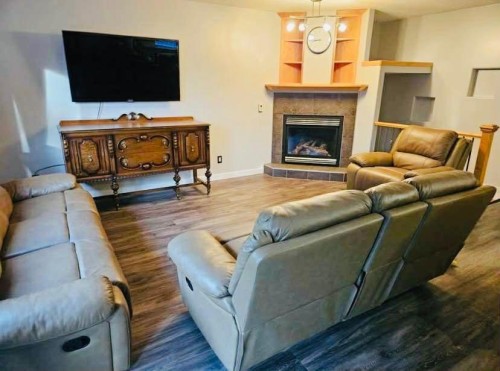 114 Poplar Drive, Whitecourt, AB - Indoor Photo Showing Living Room With Fireplace