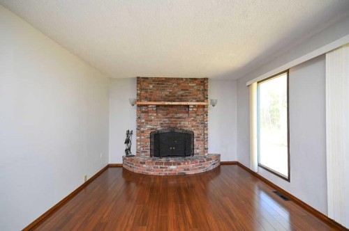 640052 Range Road 233, Rural Athabasca County, AB - Indoor Photo Showing Living Room With Fireplace