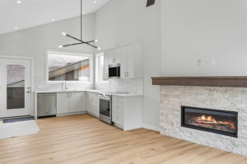 203J-209 Stewart Creek Rise, Canmore, AB - Indoor With Fireplace