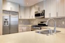 203-901 8Th Avenue, Canmore, AB  - Indoor Photo Showing Kitchen With Stainless Steel Kitchen With Double Sink With Upgraded Kitchen 