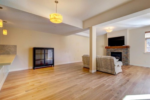 203-901 8Th Avenue, Canmore, AB - Indoor Photo Showing Living Room With Fireplace