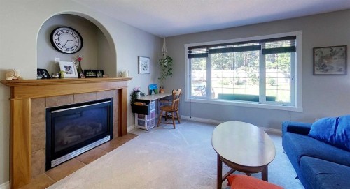 6138 11 Avenue, Edson, AB - Indoor Photo Showing Living Room With Fireplace