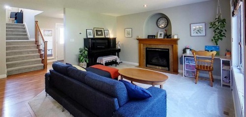 6138 11 Avenue, Edson, AB - Indoor Photo Showing Living Room With Fireplace