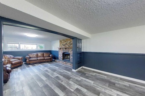 309 4 Street Ne, Slave Lake, AB - Indoor Photo Showing Living Room With Fireplace