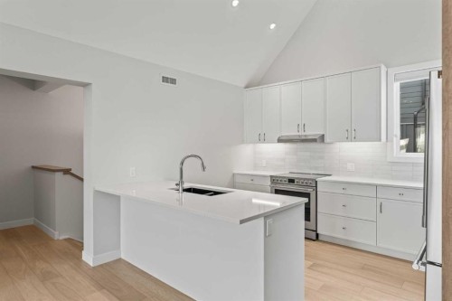 201J-209 Stewart Creek Rise, Canmore, AB - Indoor Photo Showing Kitchen