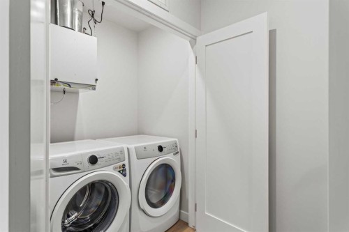 201J-209 Stewart Creek Rise, Canmore, AB - Indoor Photo Showing Laundry Room