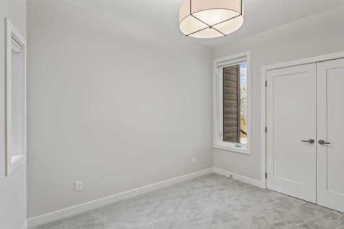 201J-209 Stewart Creek Rise, Canmore, AB - Indoor Photo Showing Other Room