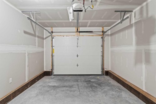 201J-209 Stewart Creek Rise, Canmore, AB - Indoor Photo Showing Garage
