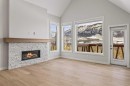201J-209 Stewart Creek Rise, Canmore, AB  - Indoor Photo Showing Living Room With Fireplace 
