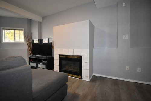 309 Eaton Drive, Hinton, AB - Indoor Photo Showing Living Room With Fireplace