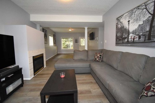309 Eaton Drive, Hinton, AB - Indoor Photo Showing Living Room With Fireplace