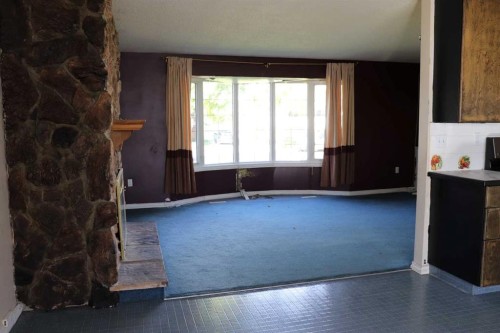 5505 13 Avenue, Edson, AB - Indoor Photo Showing Other Room With Fireplace