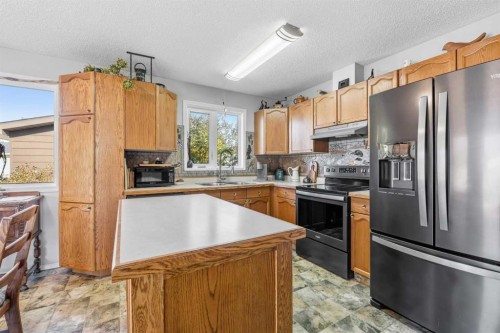 34 Hollinger Drive, Swan Hills, AB - Indoor Photo Showing Kitchen With Stainless Steel Kitchen With Double Sink