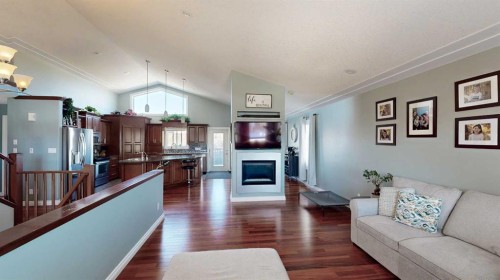 39 Cedar Heights, Whitecourt, AB - Indoor Photo Showing Living Room With Fireplace