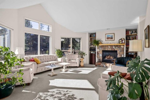 147 Benchlands Terrace South, Canmore, AB - Indoor Photo Showing Living Room With Fireplace
