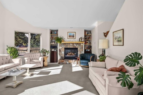 147 Benchlands Terrace South, Canmore, AB - Indoor Photo Showing Living Room With Fireplace