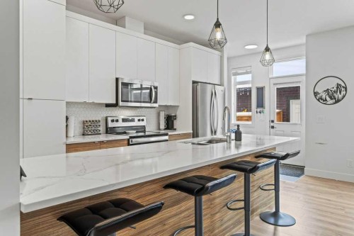216 Clydesdale Avenue, Cochrane, AB - Indoor Photo Showing Kitchen With Double Sink With Upgraded Kitchen