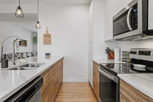 216 Clydesdale Avenue, Cochrane, AB - Indoor Photo Showing Kitchen With Double Sink With Upgraded Kitchen