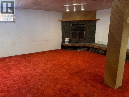 706 Hammond Drive North, Fox Creek, AB - Indoor With Fireplace