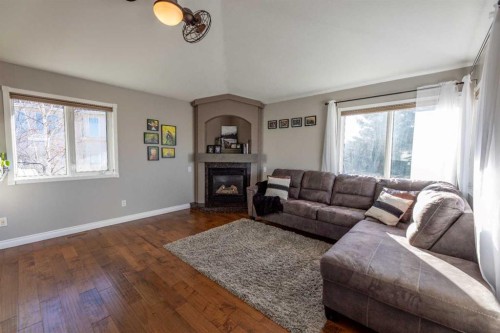 102 Marciszyn Place, Hinton, AB - Indoor Photo Showing Living Room With Fireplace