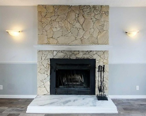 1610 53 Street, Edson, AB - Indoor Photo Showing Living Room With Fireplace