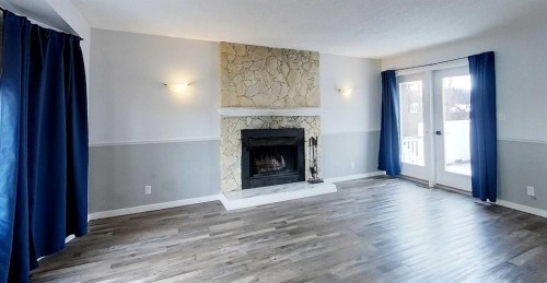 1610 53 Street, Edson, AB - Indoor Photo Showing Living Room With Fireplace