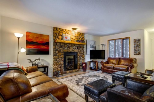 1050 Rundleview Drive, Canmore, AB - Indoor Photo Showing Living Room With Fireplace