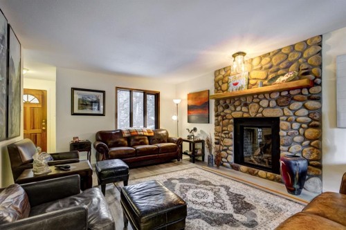 1050 Rundleview Drive, Canmore, AB - Indoor Photo Showing Living Room With Fireplace