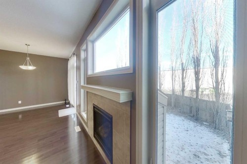 129-1600 Main Street Sw, Slave Lake, AB - Indoor Photo Showing Other Room With Fireplace