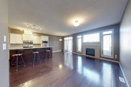 129-1600 Main Street Sw, Slave Lake, AB - Indoor Photo Showing Living Room With Fireplace