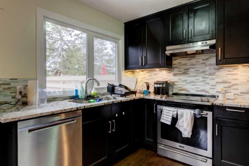 116 Nahanni Drive, Banff, AB - Indoor Photo Showing Kitchen With Upgraded Kitchen