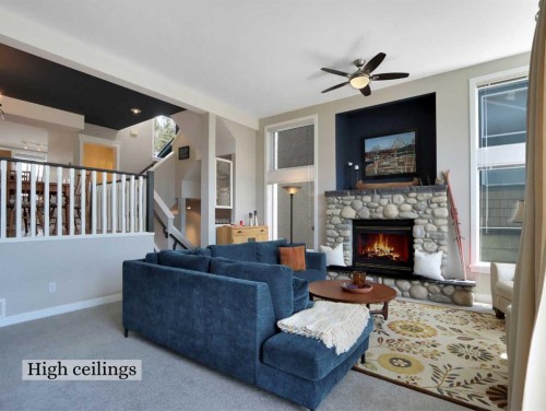 117-13 Aspen Glen, Canmore, AB - Indoor Photo Showing Living Room With Fireplace