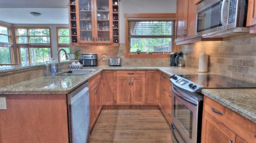 1-101 Armstrong Place, Canmore, AB - Indoor Photo Showing Kitchen With Double Sink