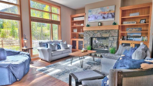 1-101 Armstrong Place, Canmore, AB - Indoor Photo Showing Living Room With Fireplace