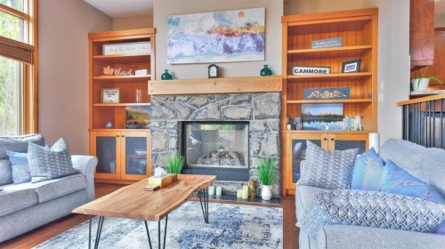 1-101 Armstrong Place, Canmore, AB - Indoor Photo Showing Living Room With Fireplace