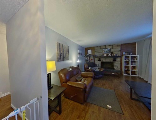 605 6 Avenue Ne, Slave Lake, AB - Indoor Photo Showing Living Room With Fireplace
