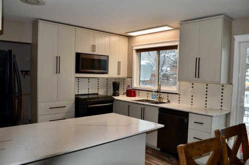 4803 45 Avenue, Athabasca, AB - Indoor Photo Showing Kitchen With Double Sink