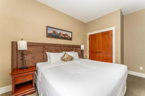 407-187 Kananaskis Way, Canmore, AB - Indoor Photo Showing Bedroom