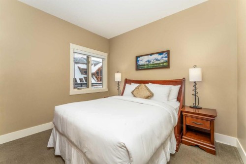 407-187 Kananaskis Way, Canmore, AB - Indoor Photo Showing Bedroom