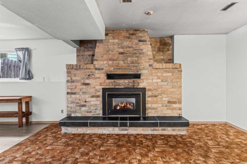 1001 9Th Avenue, Canmore, AB - Indoor Photo Showing Living Room With Fireplace