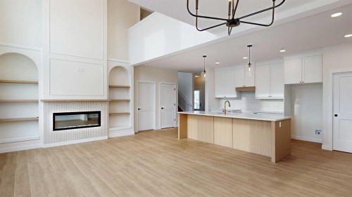 23 Riverdale Bend, Whitecourt, AB - Indoor Photo Showing Kitchen With Fireplace