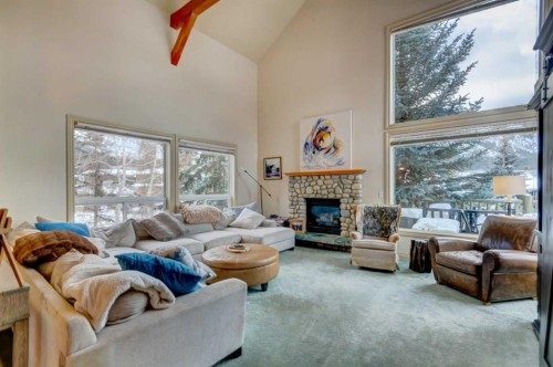 A-510 Wolf Street, Banff, AB - Indoor Photo Showing Living Room With Fireplace