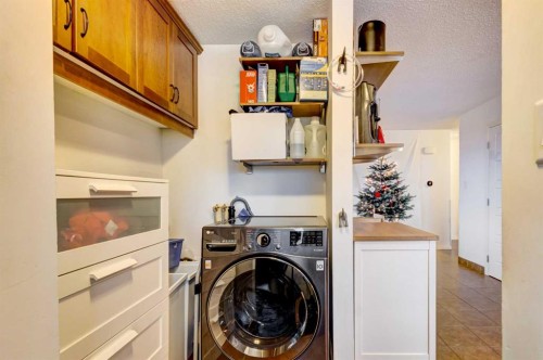 A-208 Muskrat Street, Banff, AB - Indoor Photo Showing Laundry Room