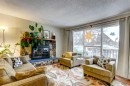A-208 Muskrat Street, Banff, AB  - Indoor Photo Showing Living Room With Fireplace 