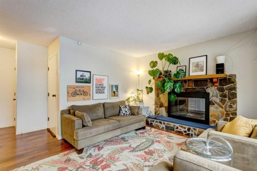 A-208 Muskrat Street, Banff, AB - Indoor Photo Showing Living Room With Fireplace