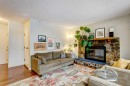 A-208 Muskrat Street, Banff, AB  - Indoor Photo Showing Living Room With Fireplace 