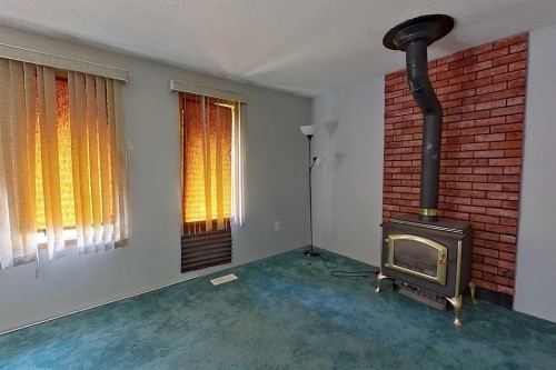 5009 48 Avenue, Athabasca, AB - Indoor Photo Showing Other Room With Fireplace