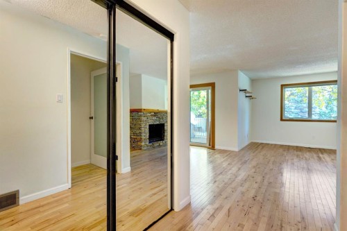 105-200 Three Sisters Drive, Canmore, AB - Indoor Photo Showing Other Room With Fireplace