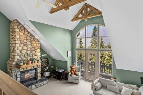 14 Antelope Lane, Banff, AB - Indoor With Fireplace
