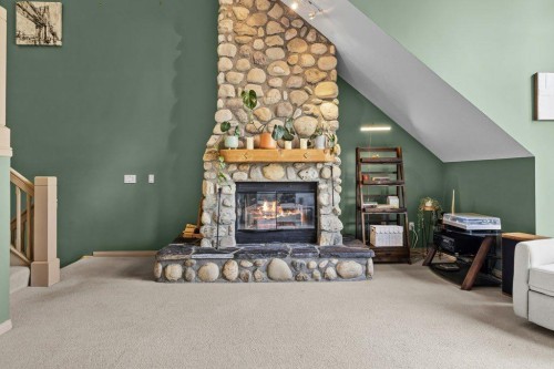 14 Antelope Lane, Banff, AB - Indoor With Fireplace